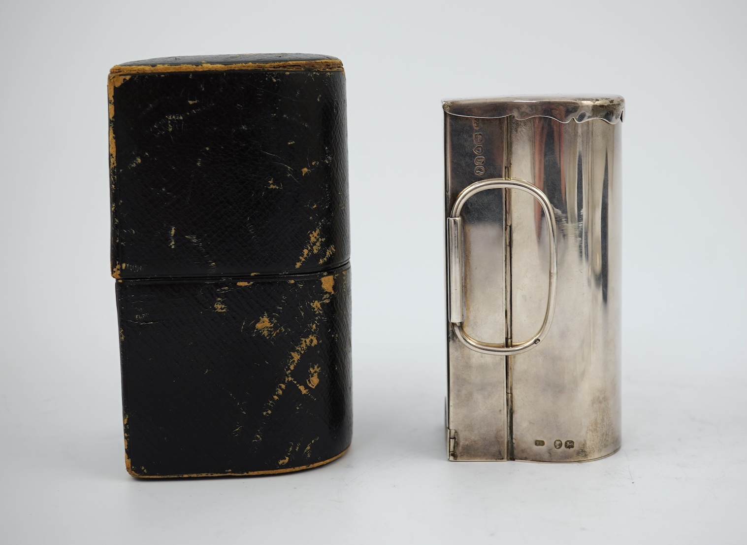 A Victorian silver travelling coach lamp by Thomas Johnson I, in original fitted leather case, retailed by Leuchers, 38 Piccadilly, London